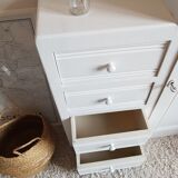 Old white asymmetrical chest of drawers