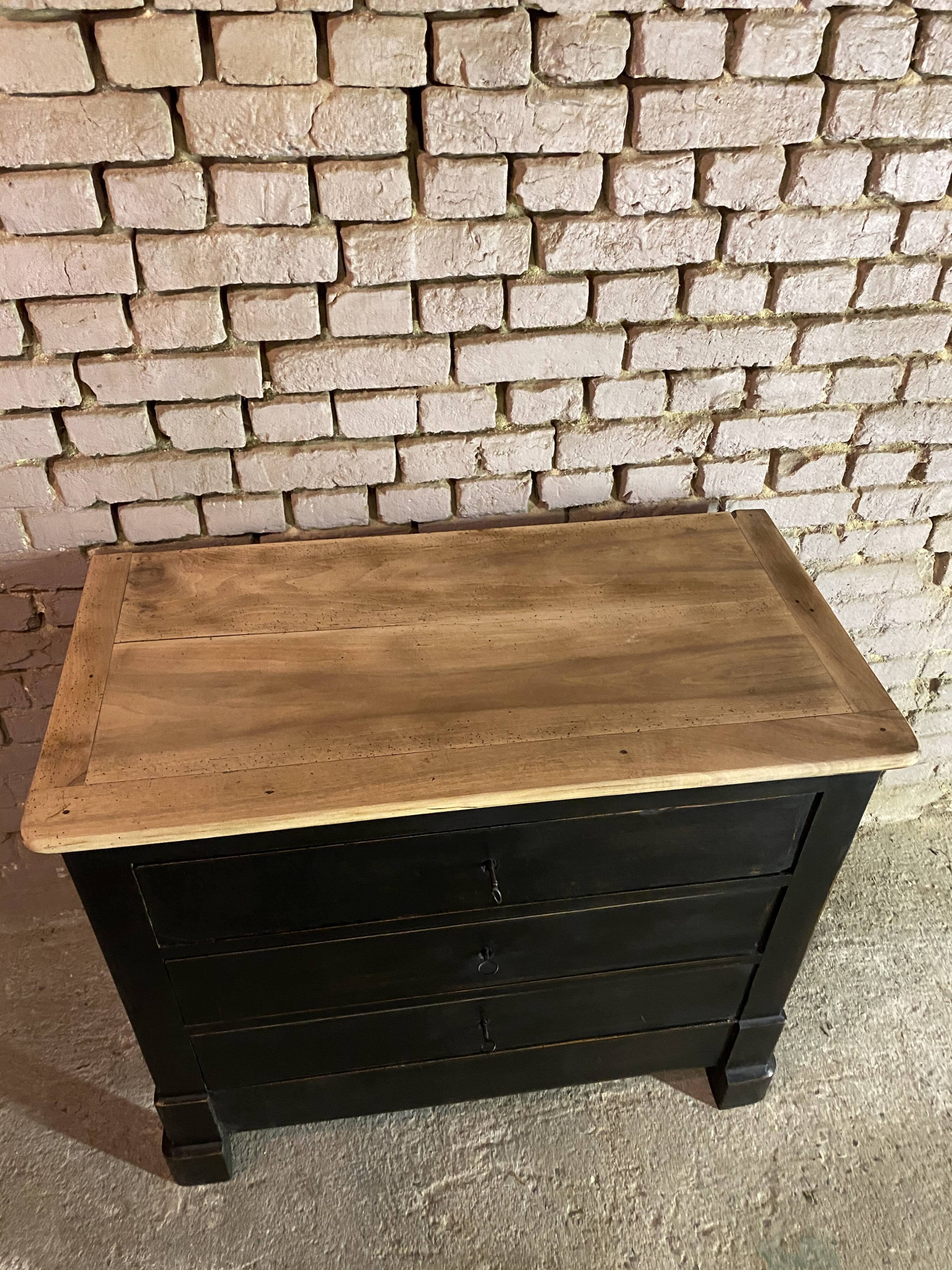 Old black patinated chest of drawers