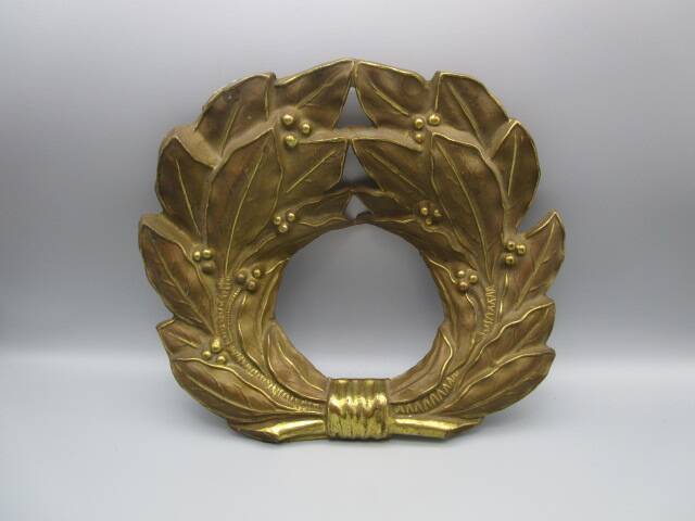 Old ornament in embossed brass - laurel wreath