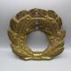 Old ornament in embossed brass - laurel wreath