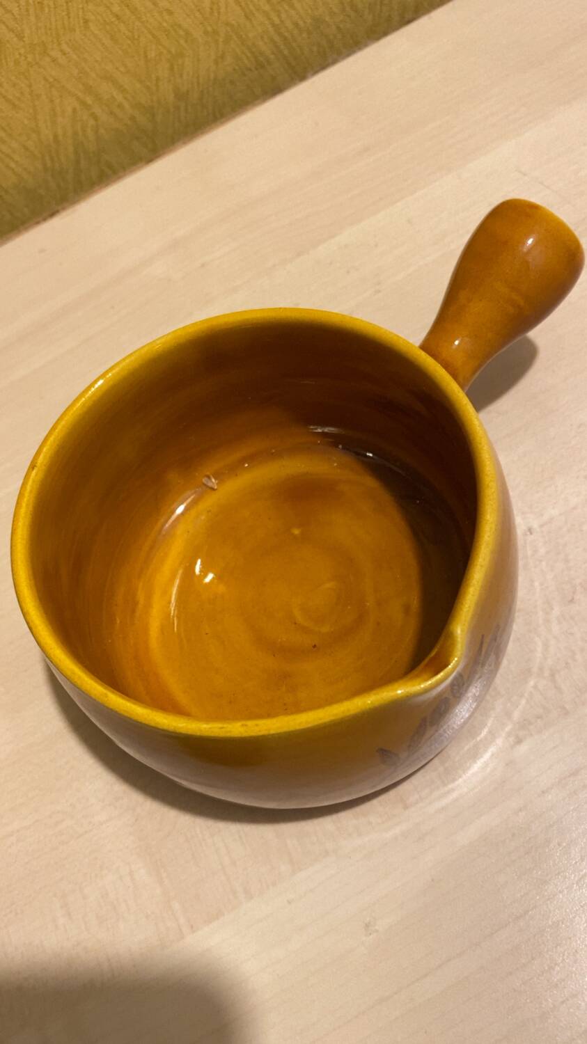 Glazed yellow earthenware fondue pot