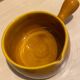 Glazed yellow earthenware fondue pot
