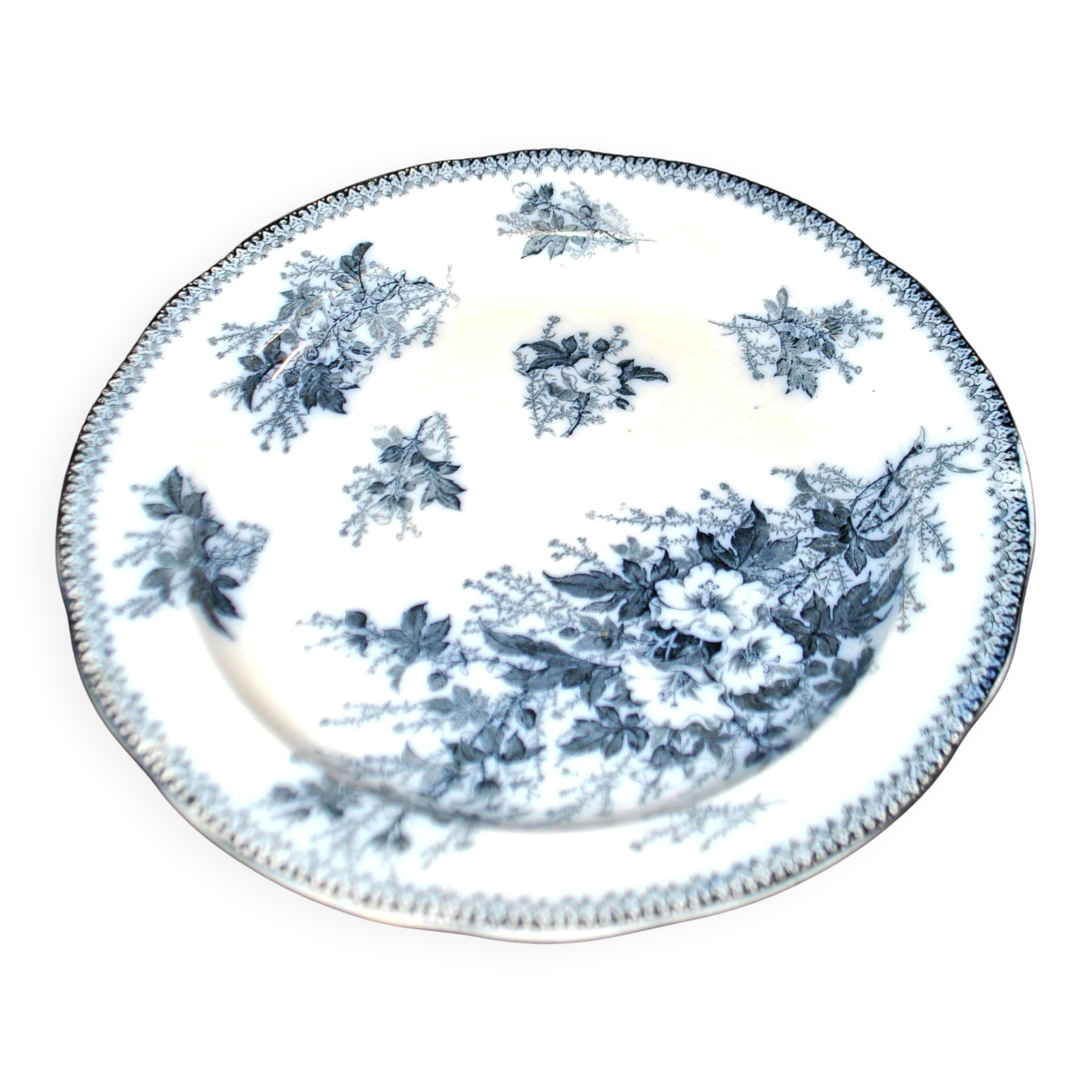 Large round antique plate with monochrome blue and black floral decoration, circa 1850.