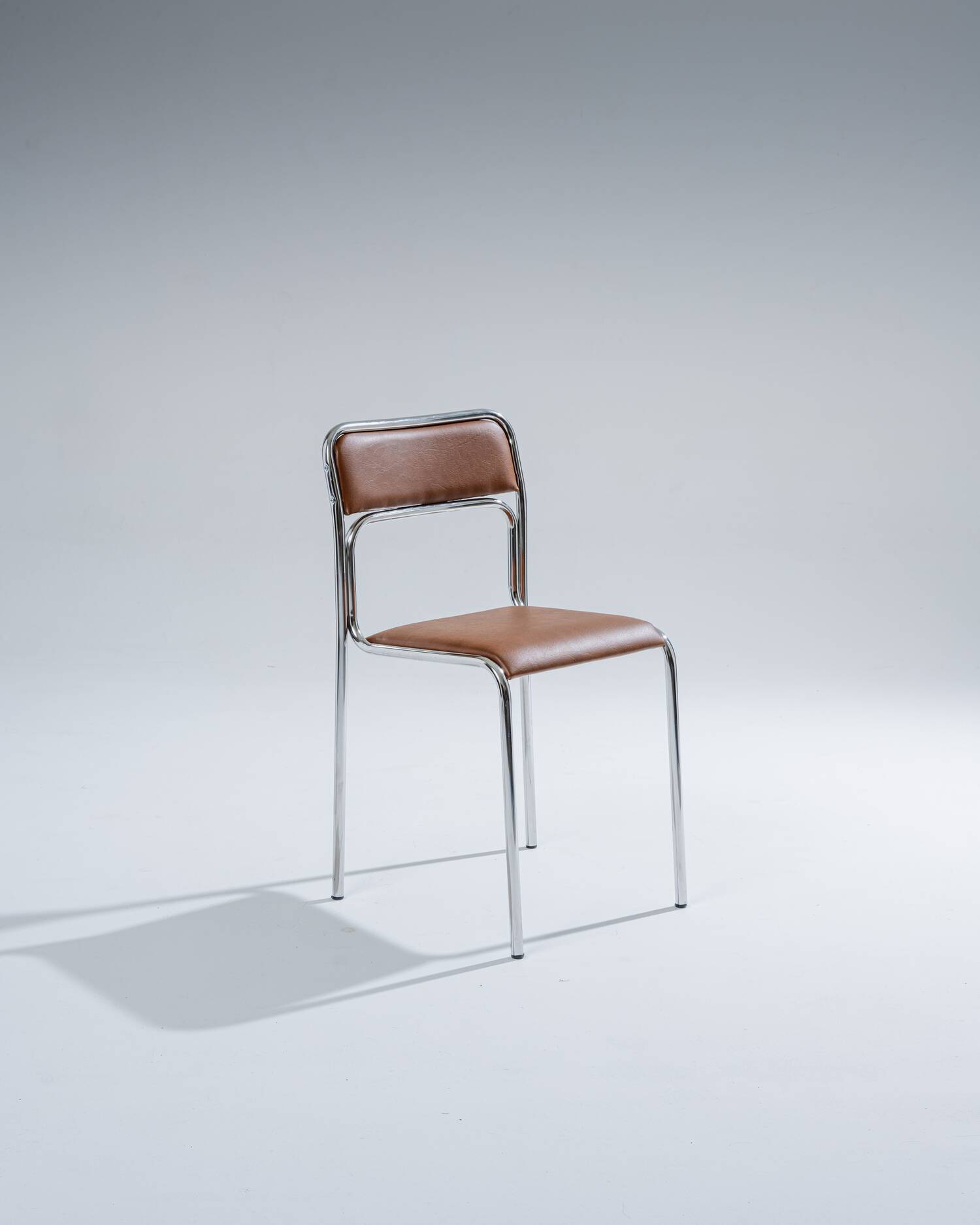 Tubular steel and cognac leatherette chair, 1980s