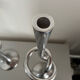 Pair of large kare design cast aluminum candlesticks