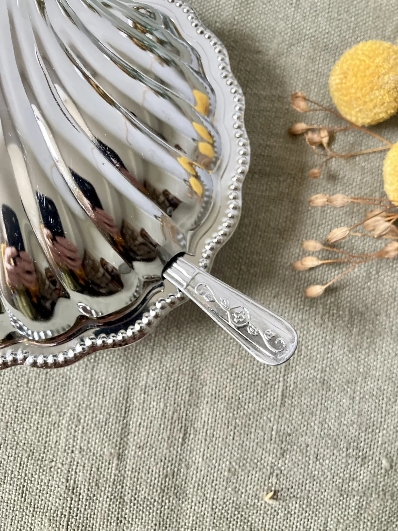 Metal shell butter dish with glass bowl and knife