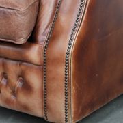 Chesterfield armchair in English style made of cowhide leather