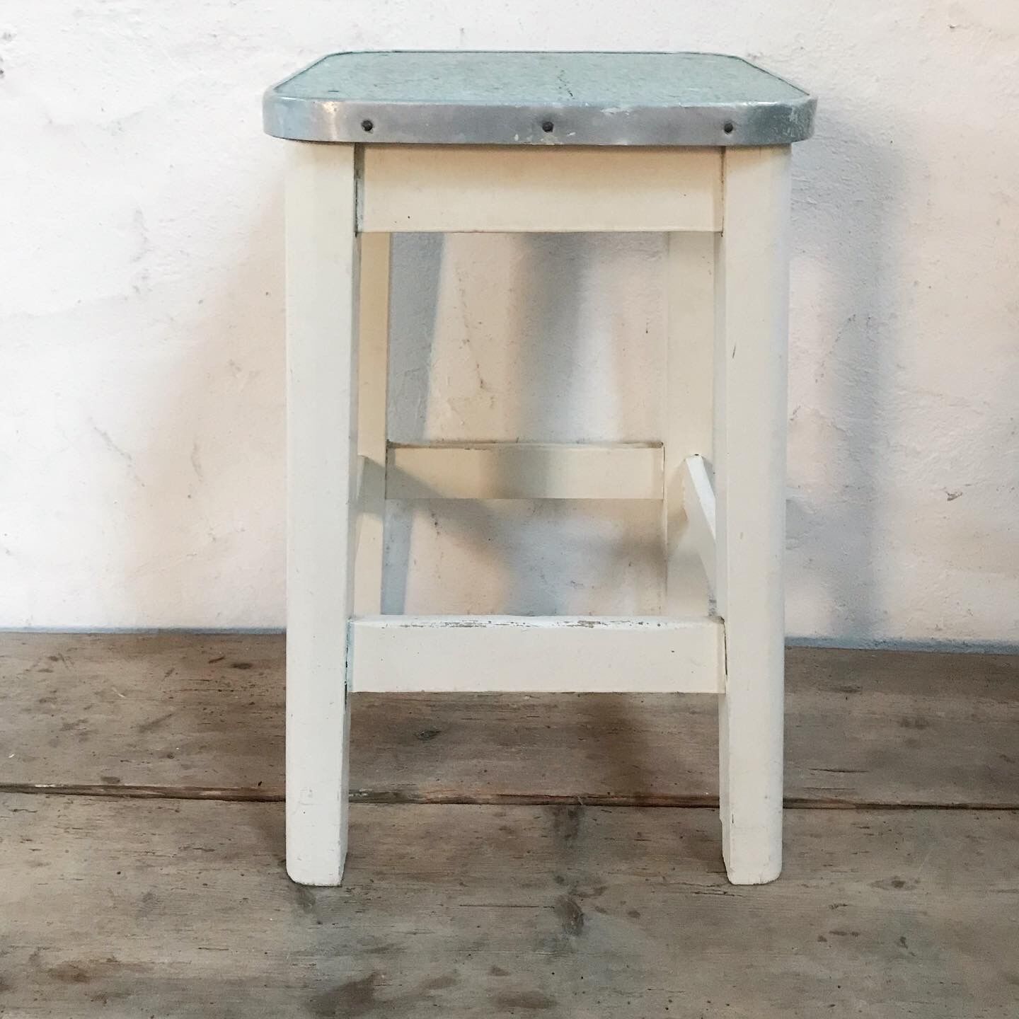 Antique wooden stool and formica