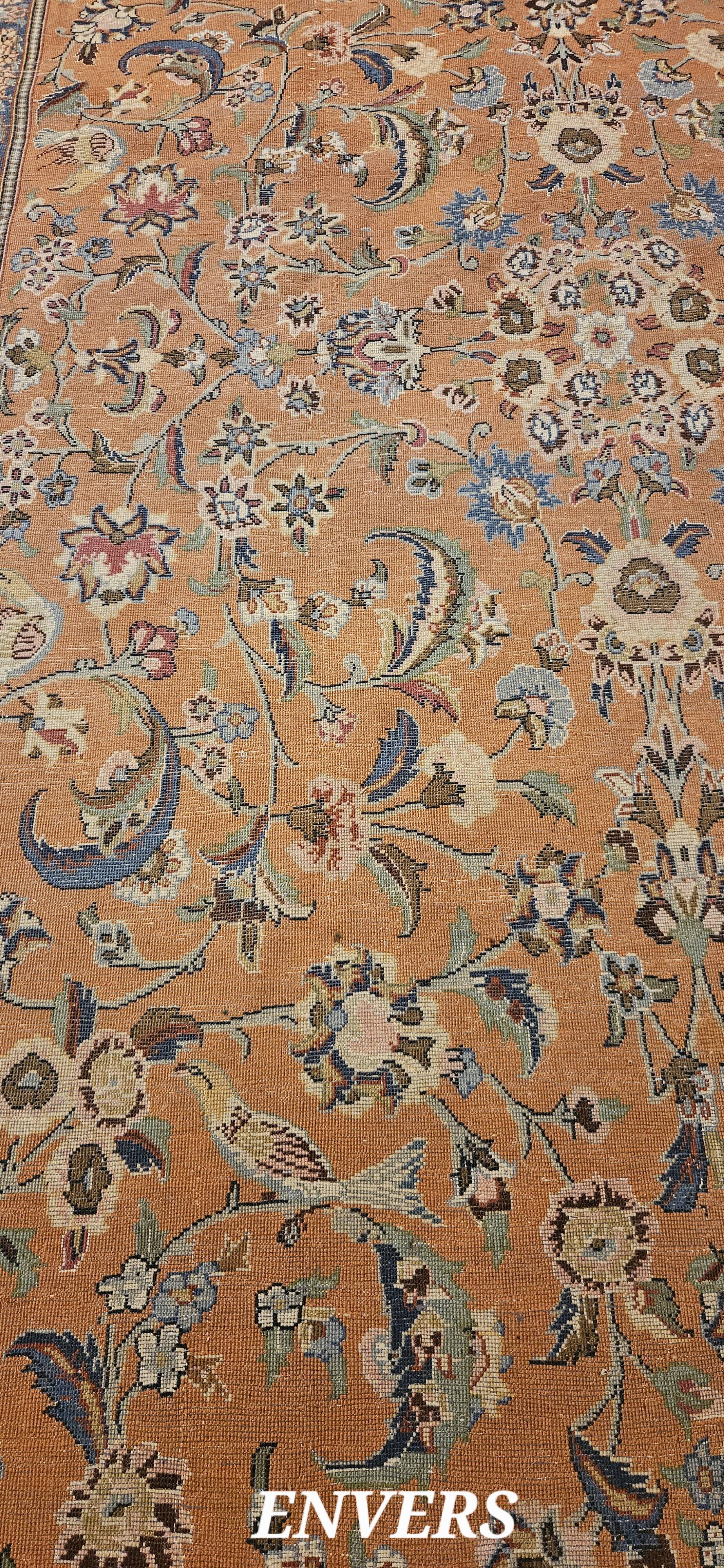 Large wool and silk oriental carpet.