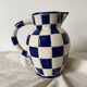 Antique blue and white checkered pitcher