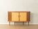 Cabinet de bar élégant des années 1950 avec compartiment rotatif et dos en miroir.