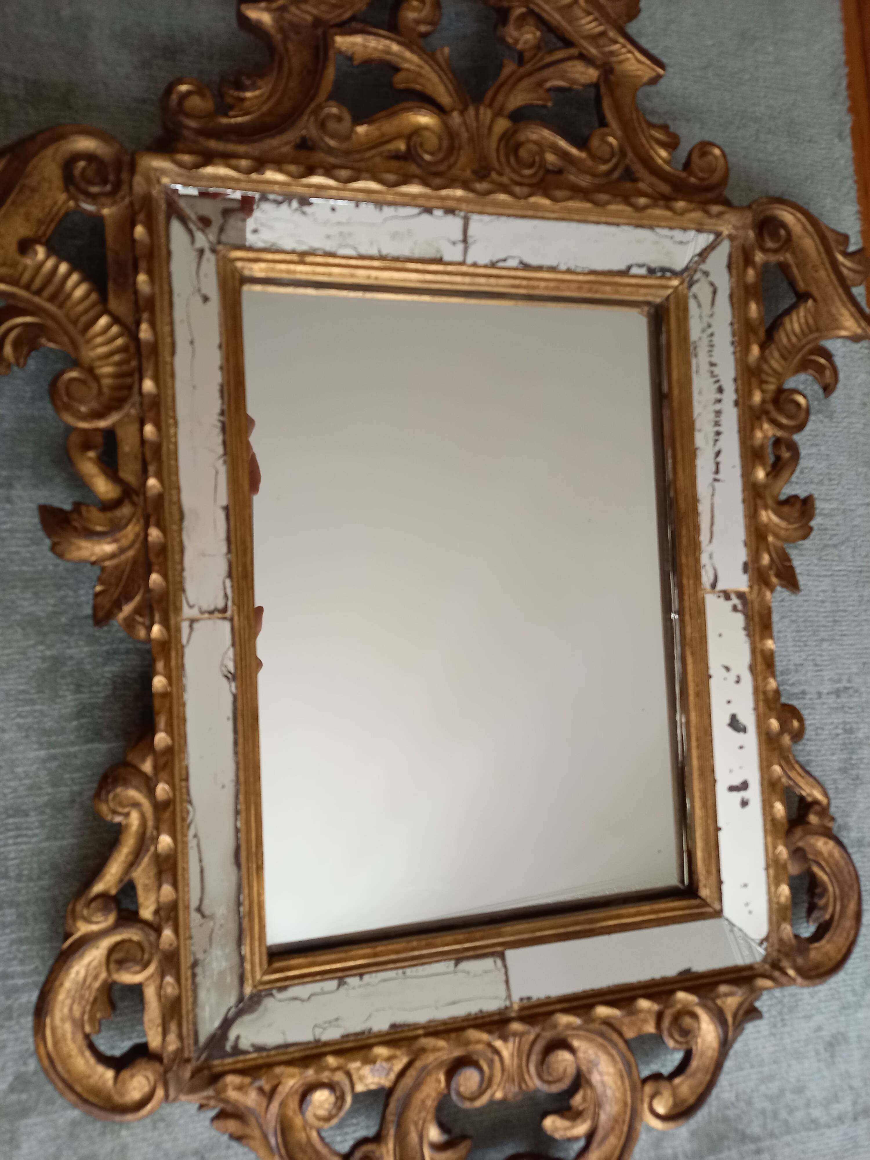Antique gilded wooden mirror with mouldings, Louis XV style.