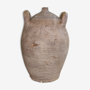 Ancient sandstone jar with two handles