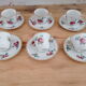 Lot de 6 tasses à café et sous-tasses décor fleuri et liseré doré, porcelaine de Limoges Bernardaud