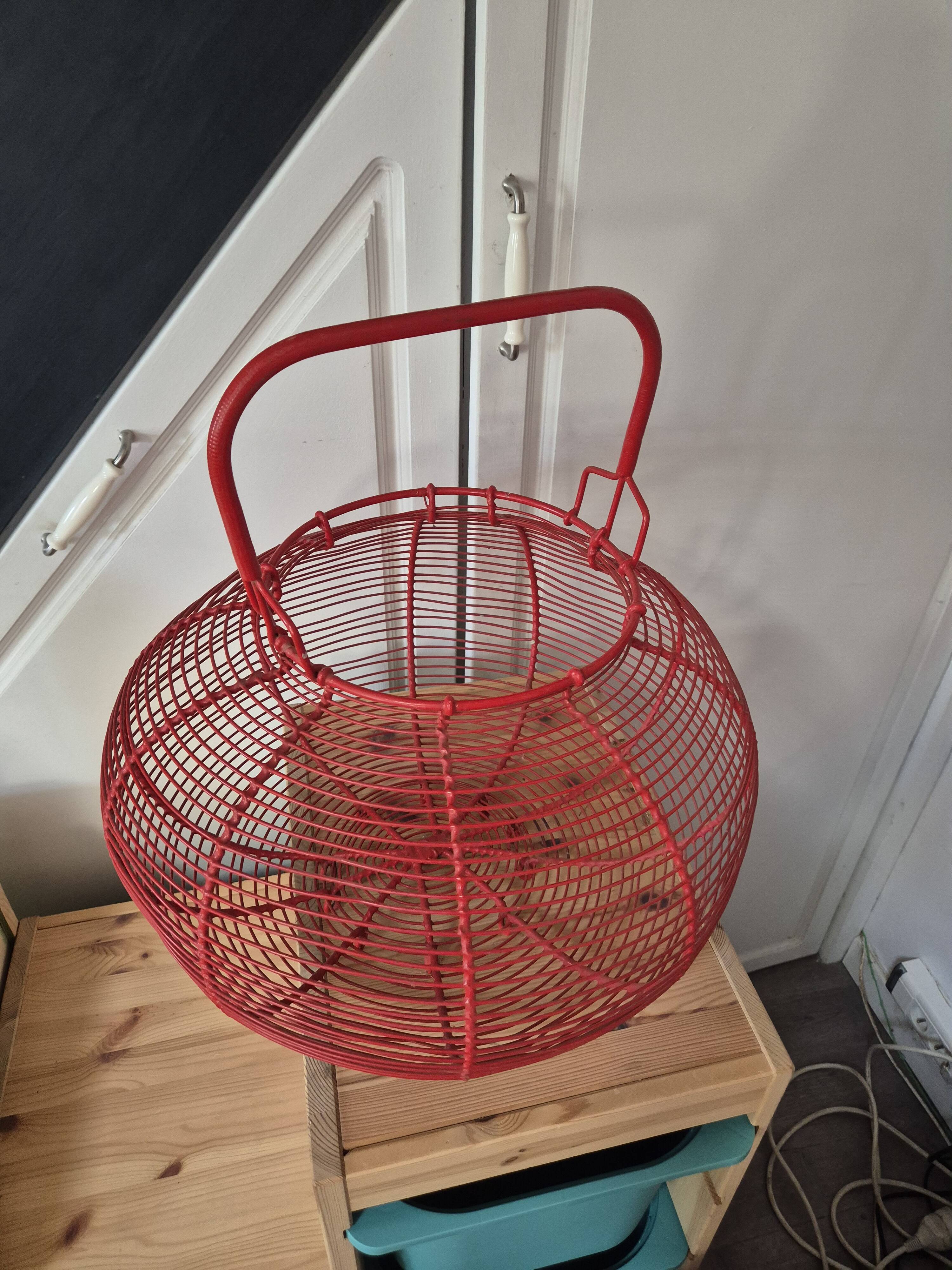 very large vintage red metal basket with handle