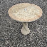 Cement garden table with trunk-shaped foot