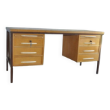 Mid-century Hungarian brown wooden desk with symmetrical drawers and white handles.