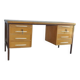 Mid-century Hungarian brown wooden desk with symmetrical drawers and white handles.