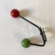 Small double coat hook in metal and wood painted green and red, 1950s-60s