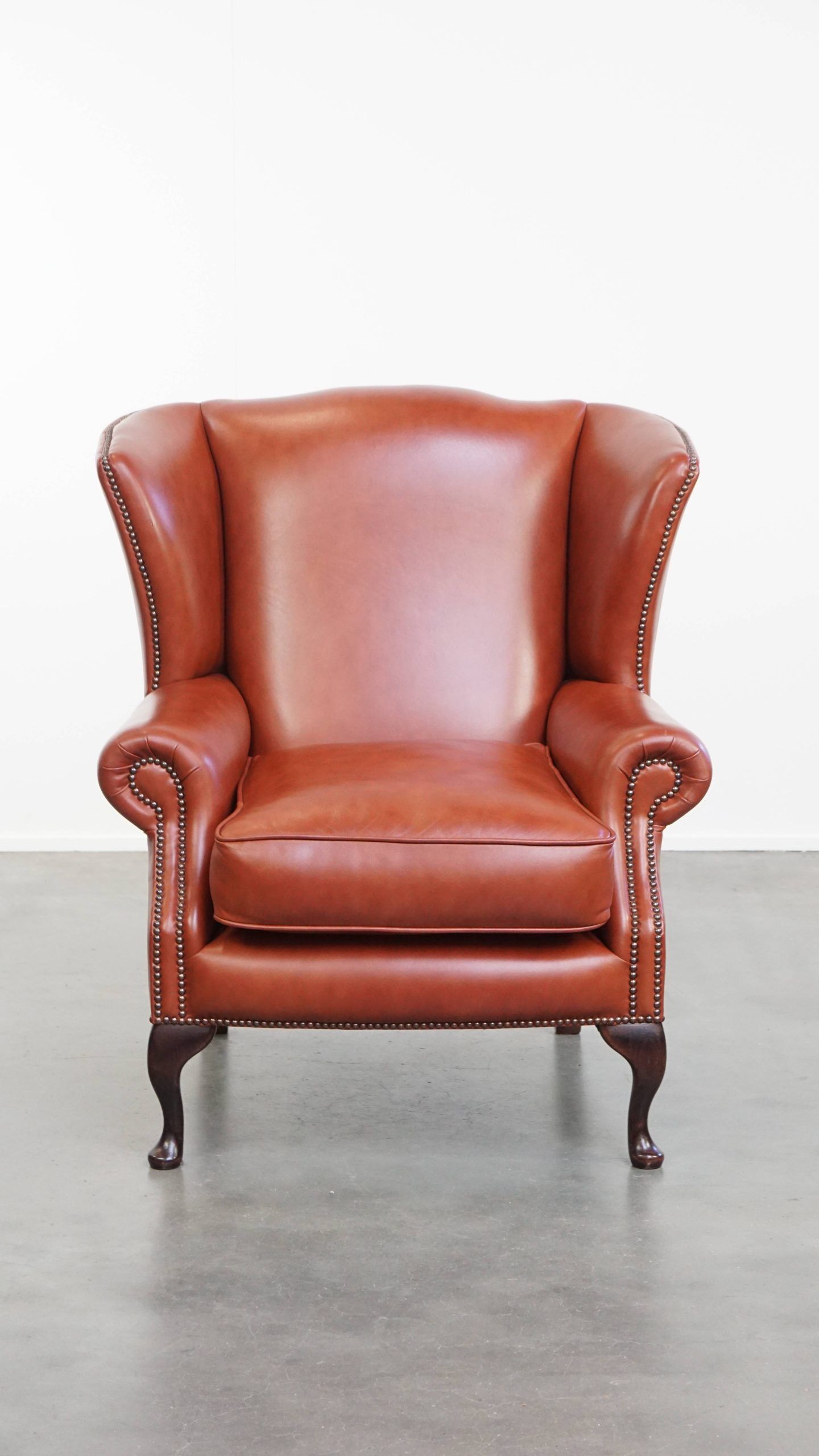 Elegant smooth English cowhide leather Chesterfield wingback armchair