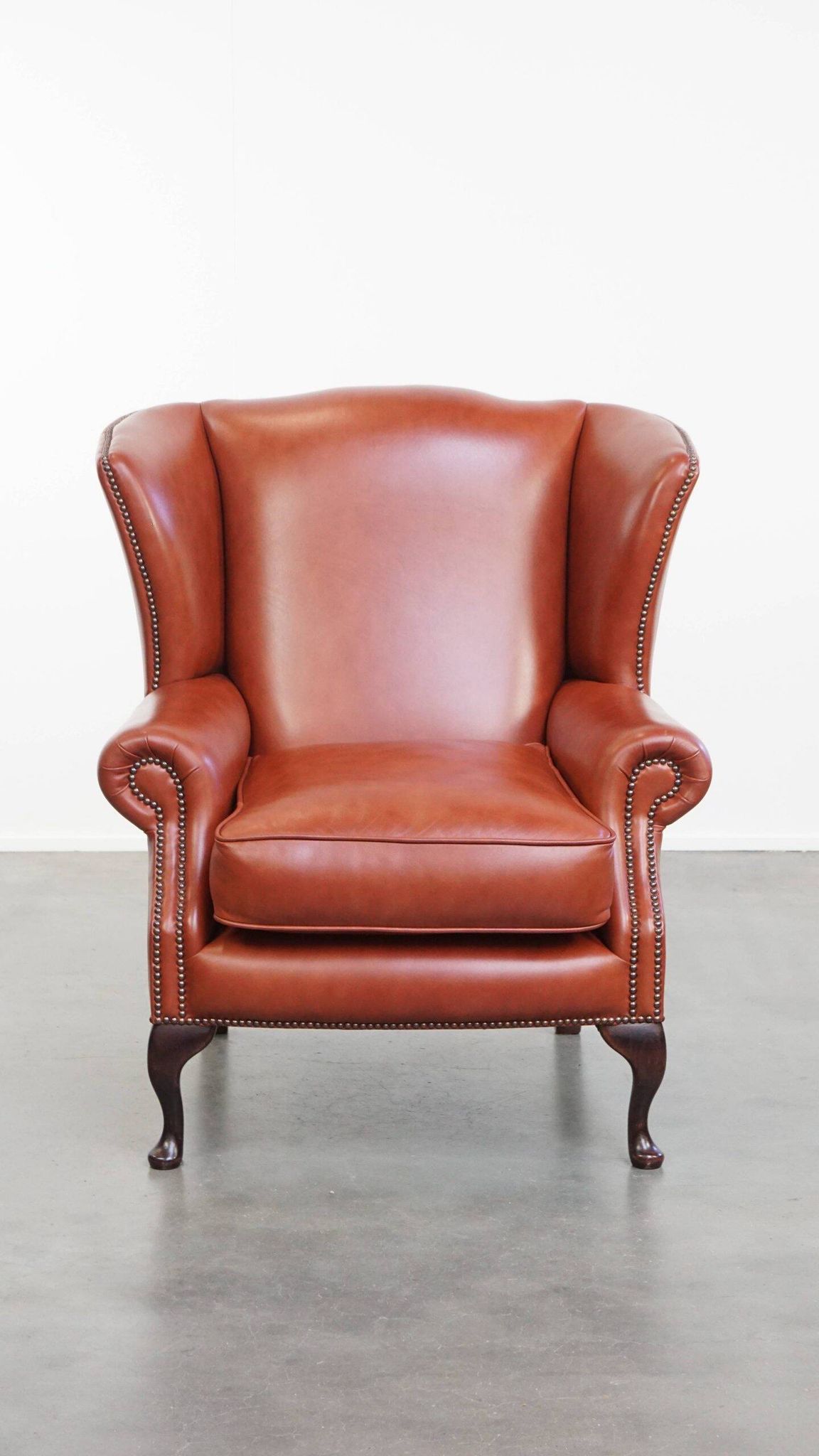 Elegant smooth English cowhide leather Chesterfield wingback armchair