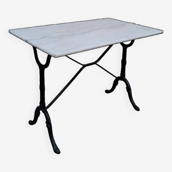 Bistro restaurant table in marble and old cast iron