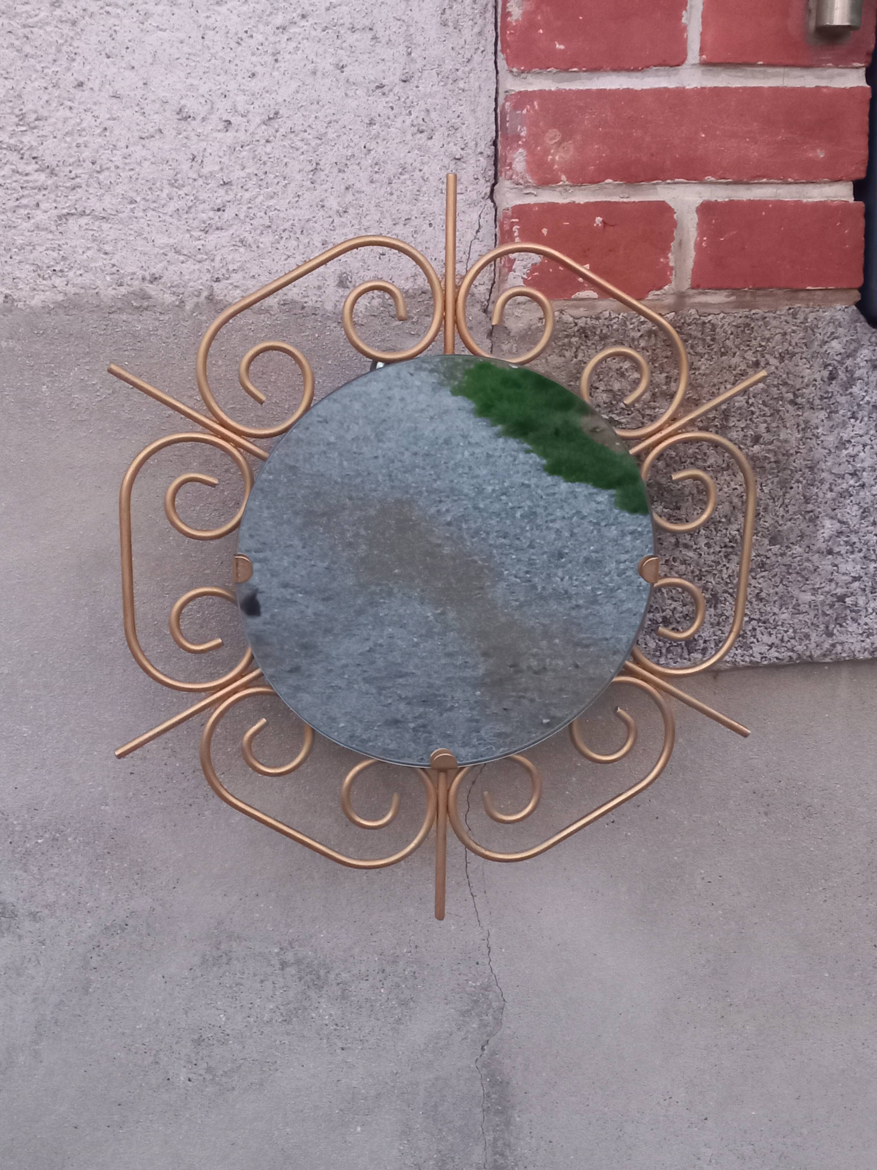 Golden metal sun mirror from the 1950s.