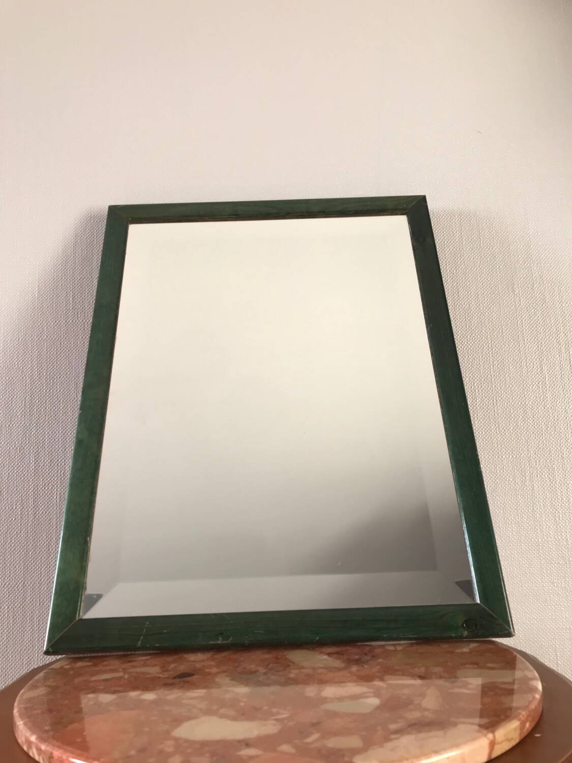 Beveled mirror and varnished wooden frame
