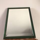 Beveled mirror and varnished wooden frame