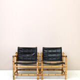 Paire de fauteuils vintage en cuir et bambou