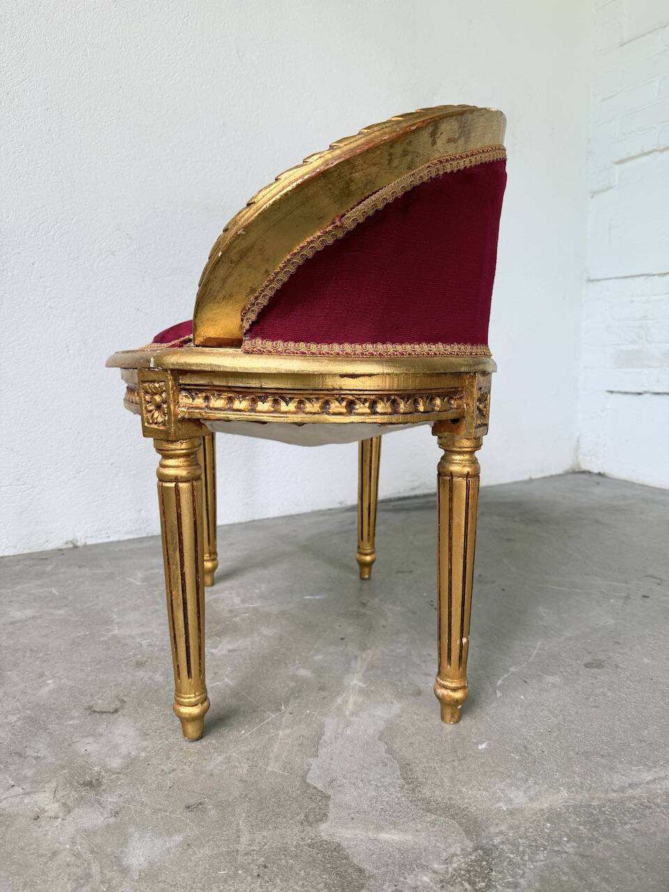 Louis XVI gilt wood and red velvet armchair