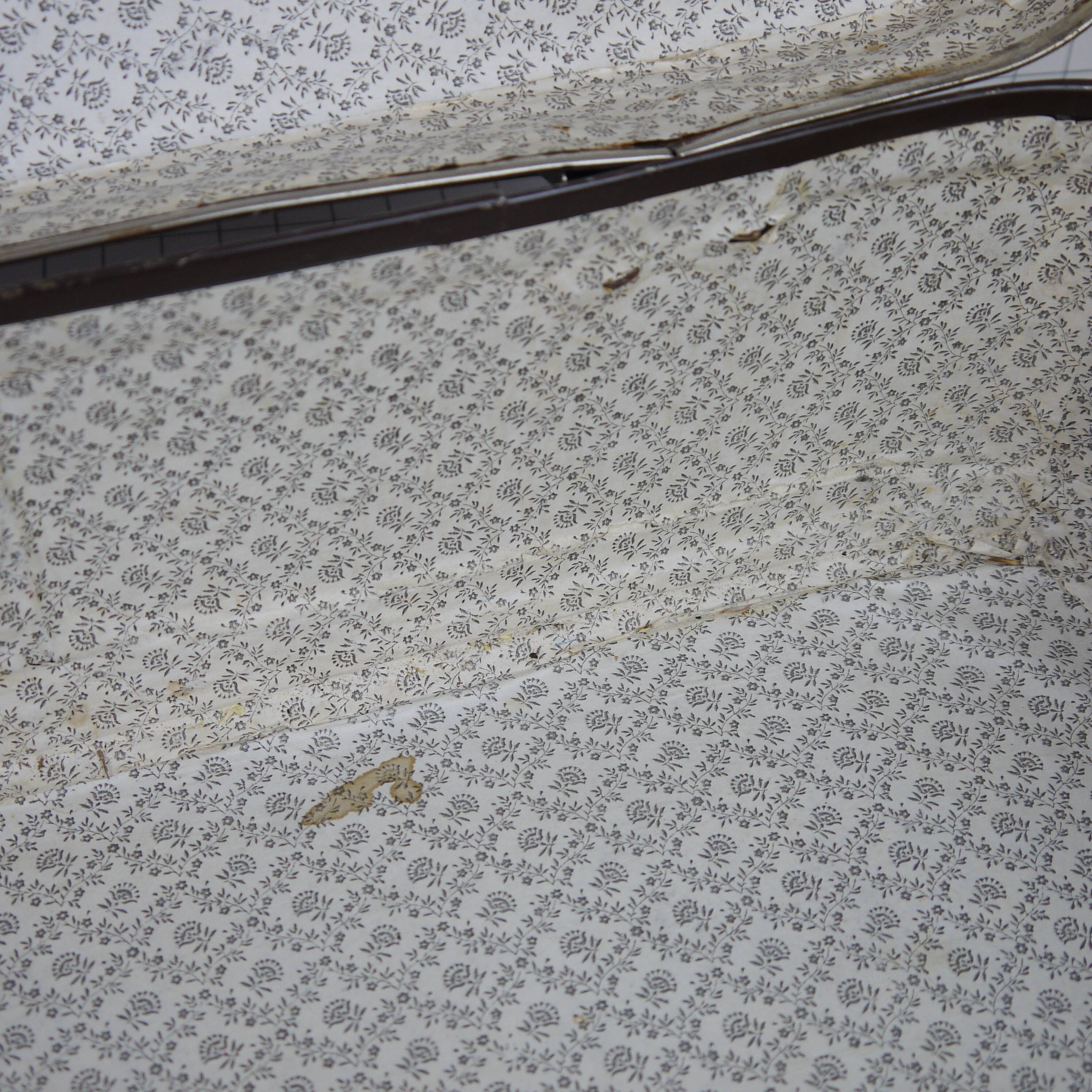 Cardboard and brown leather case