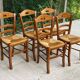 12 solid wood and straw chairs