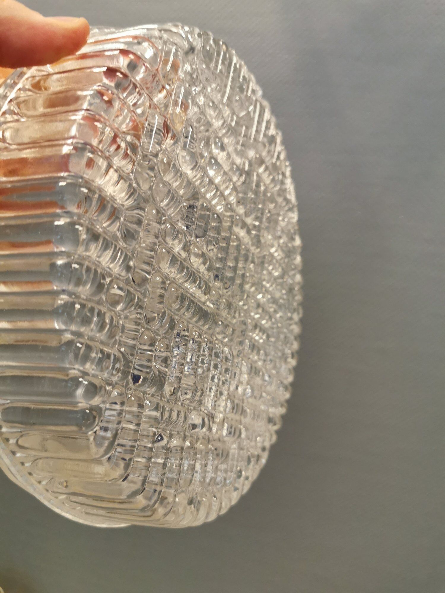 Ceiling light, in dark metallic paint with thick glass shade with beautiful details in the glass.