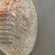 Ceiling light, in dark metallic paint with thick glass shade with beautiful details in the glass.