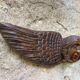 Carved wooden angel head