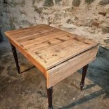 Vintage French pine table with extendable side, circa 1930, suitable for kitchen or office use.