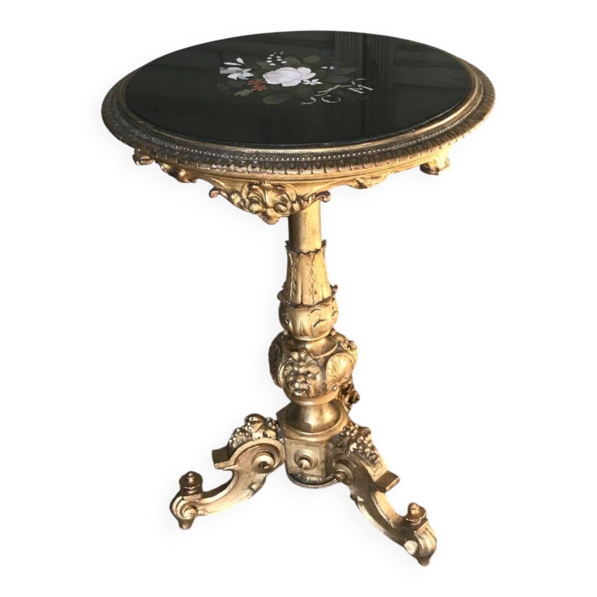 A gilded carved wooden pedestal table with a marble marquetry top