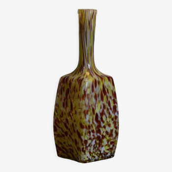 Yellow and white speckled decanter