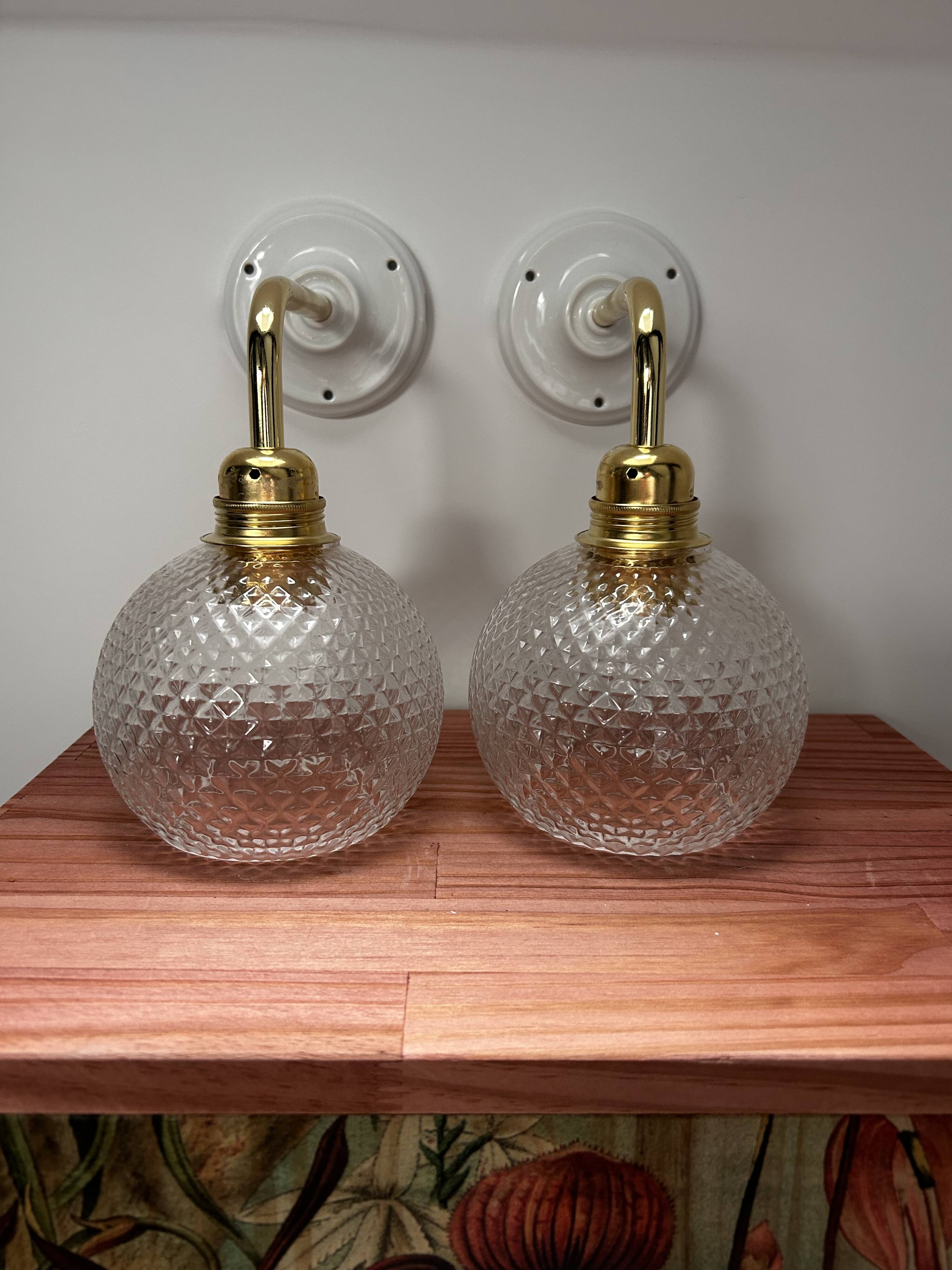 Pair of chiseled glass wall sconces