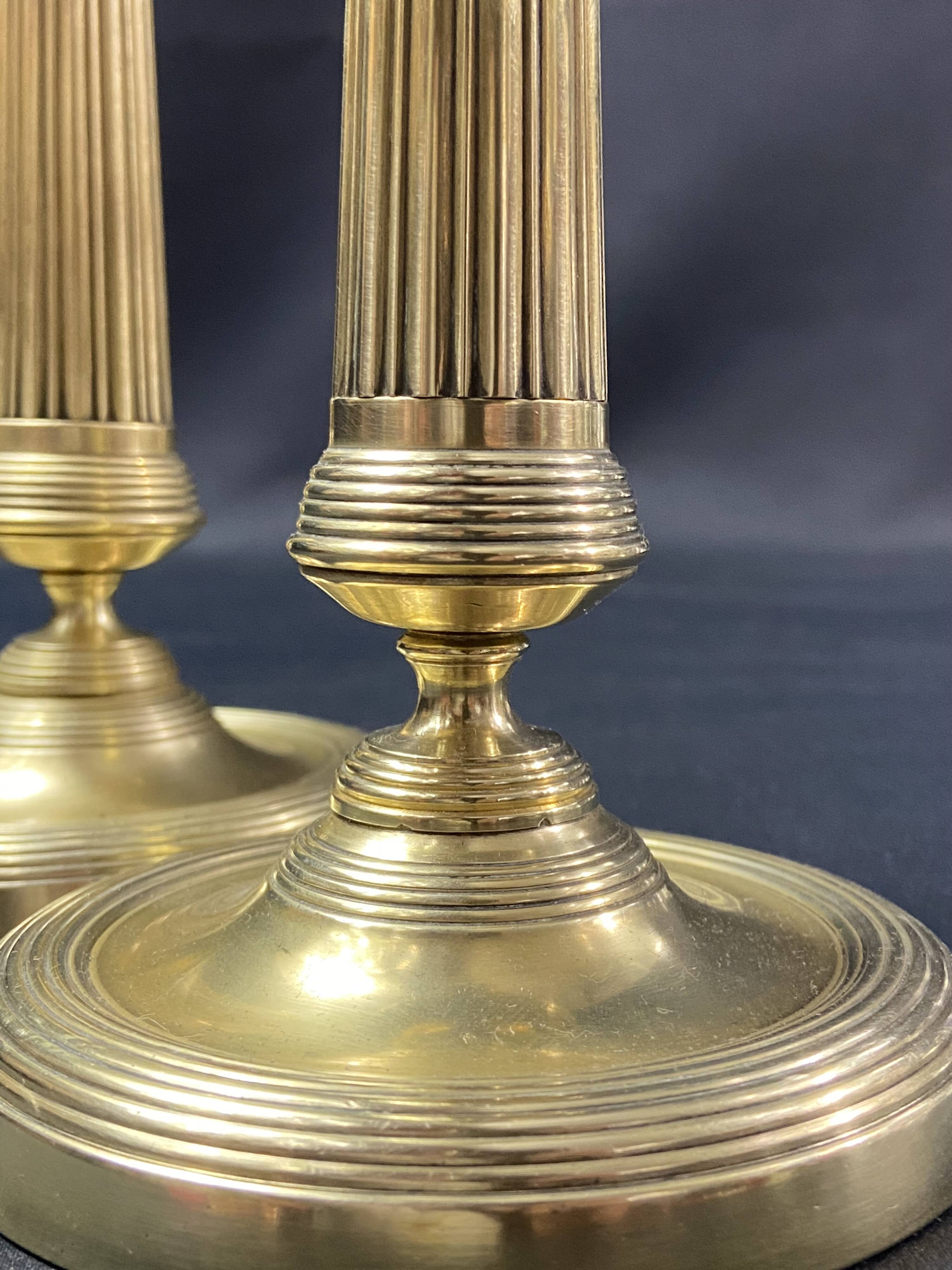 Pair of 19th century gilt bronze candlesticks with fluted shafts, Restoration
