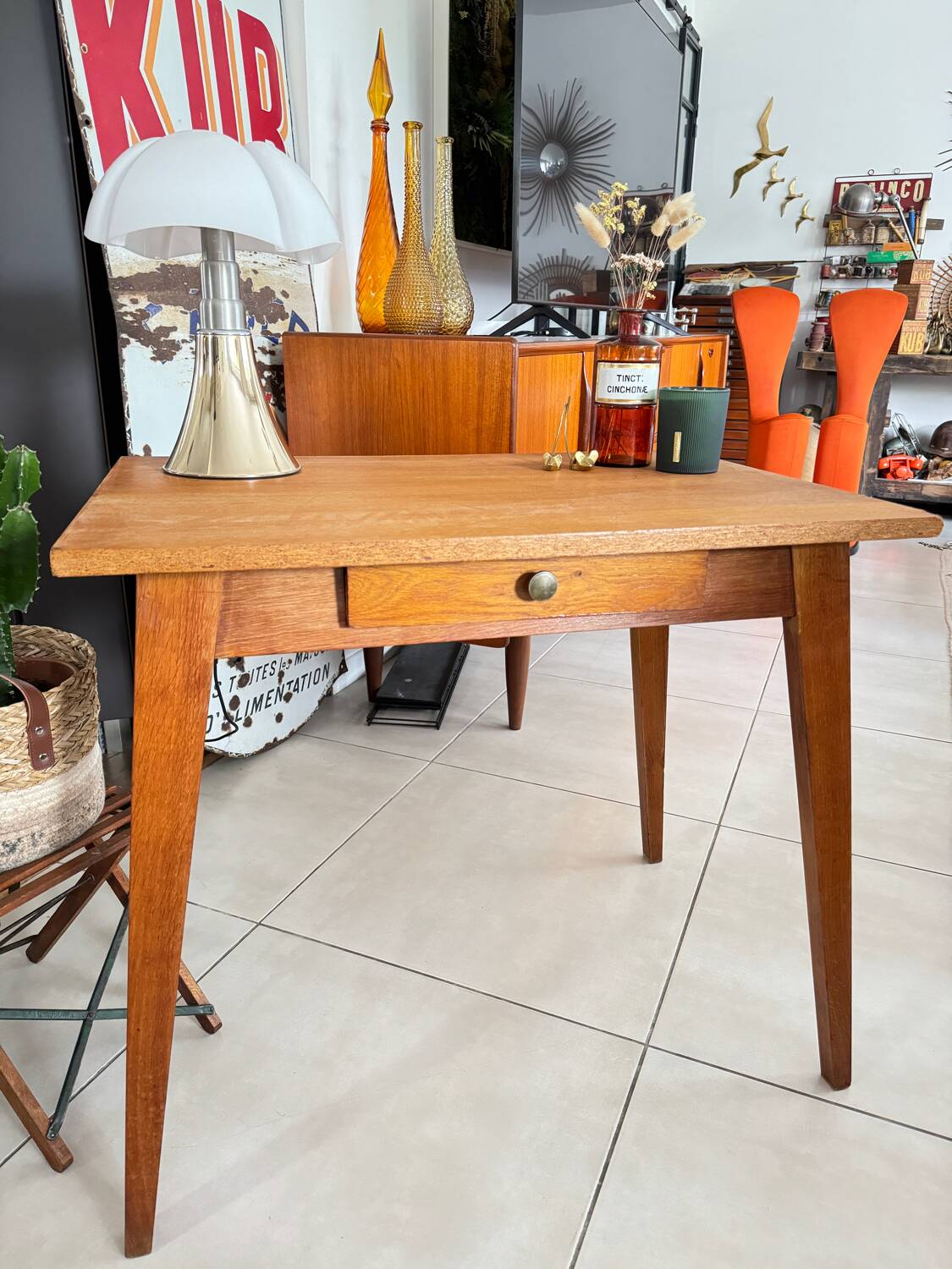 Old wooden desk or side table with compass legs