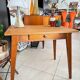 Old wooden desk or side table with compass legs