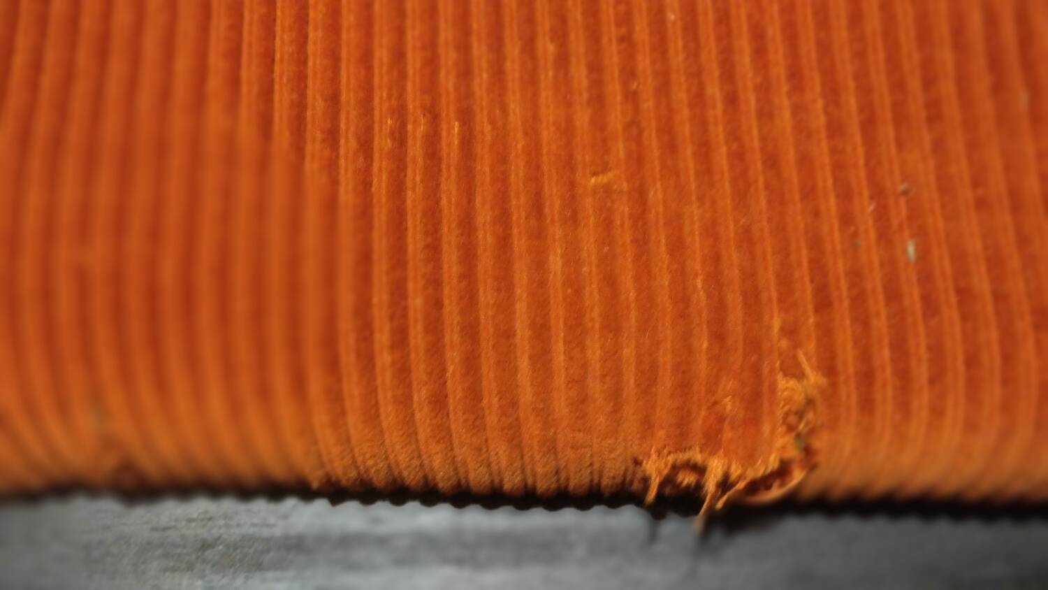 Set of three vintage armchairs. 1970s. Orange corduroy.