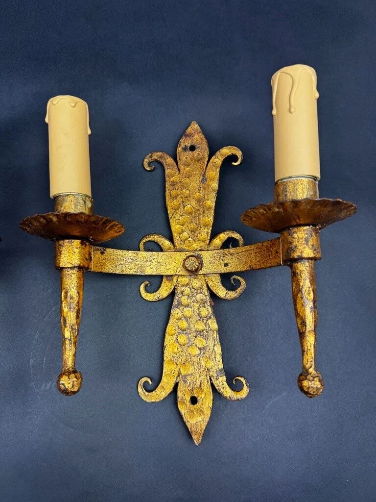 Pair of electrified golden wrought iron gothic wall sconces.