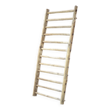 Old vintage wooden animal barrier, wall espalier, plant holder