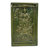 Antique tile in green faience, motif of Saint George and the dragon