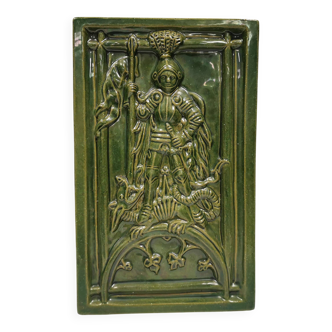 Antique tile in green faience, motif of Saint George and the dragon