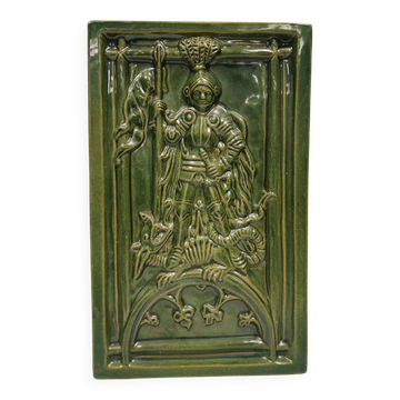 Antique tile in green faience, motif of Saint George and the dragon