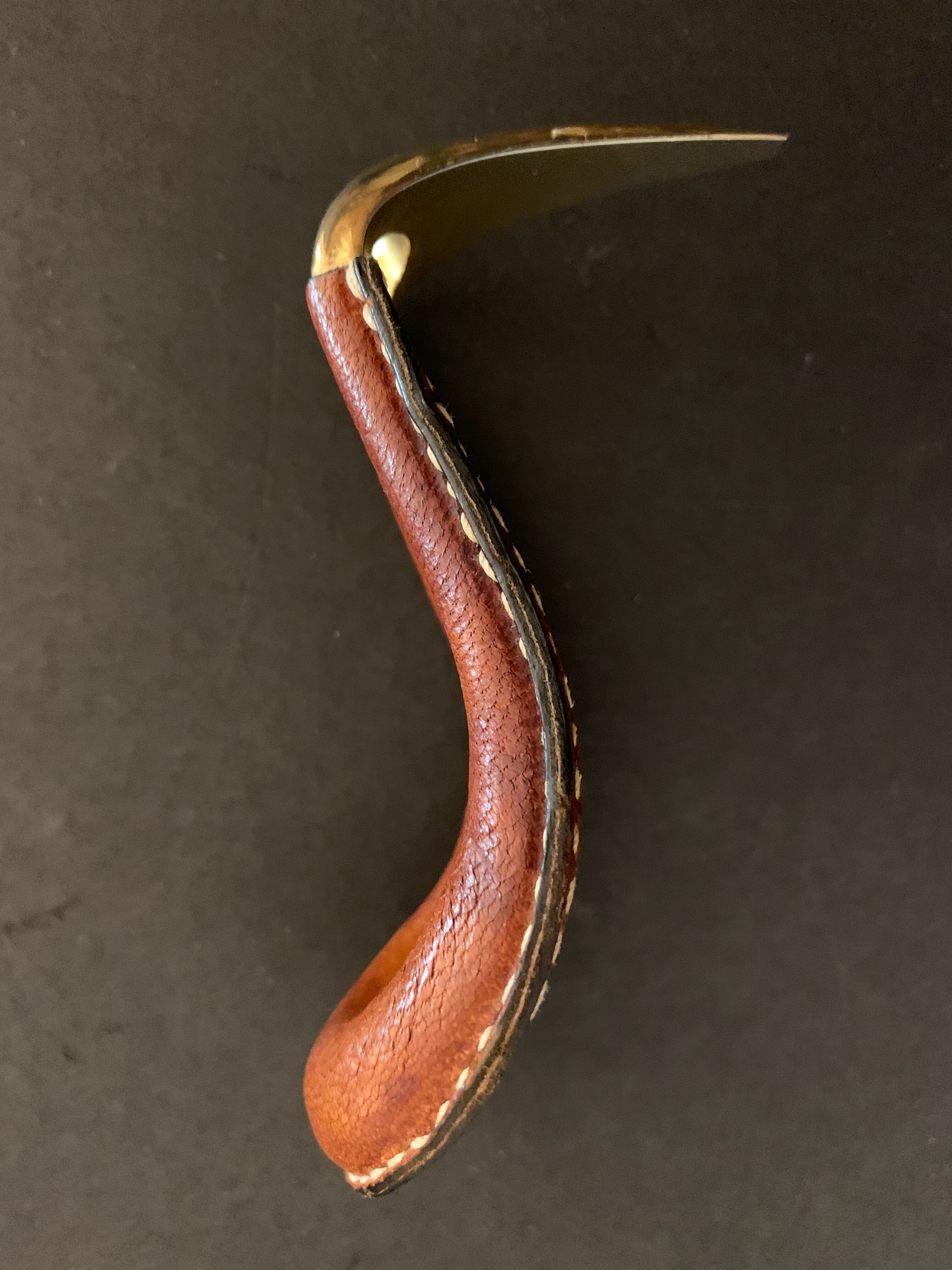 Carl Auböck pipe rack in leather and bronze, 1963